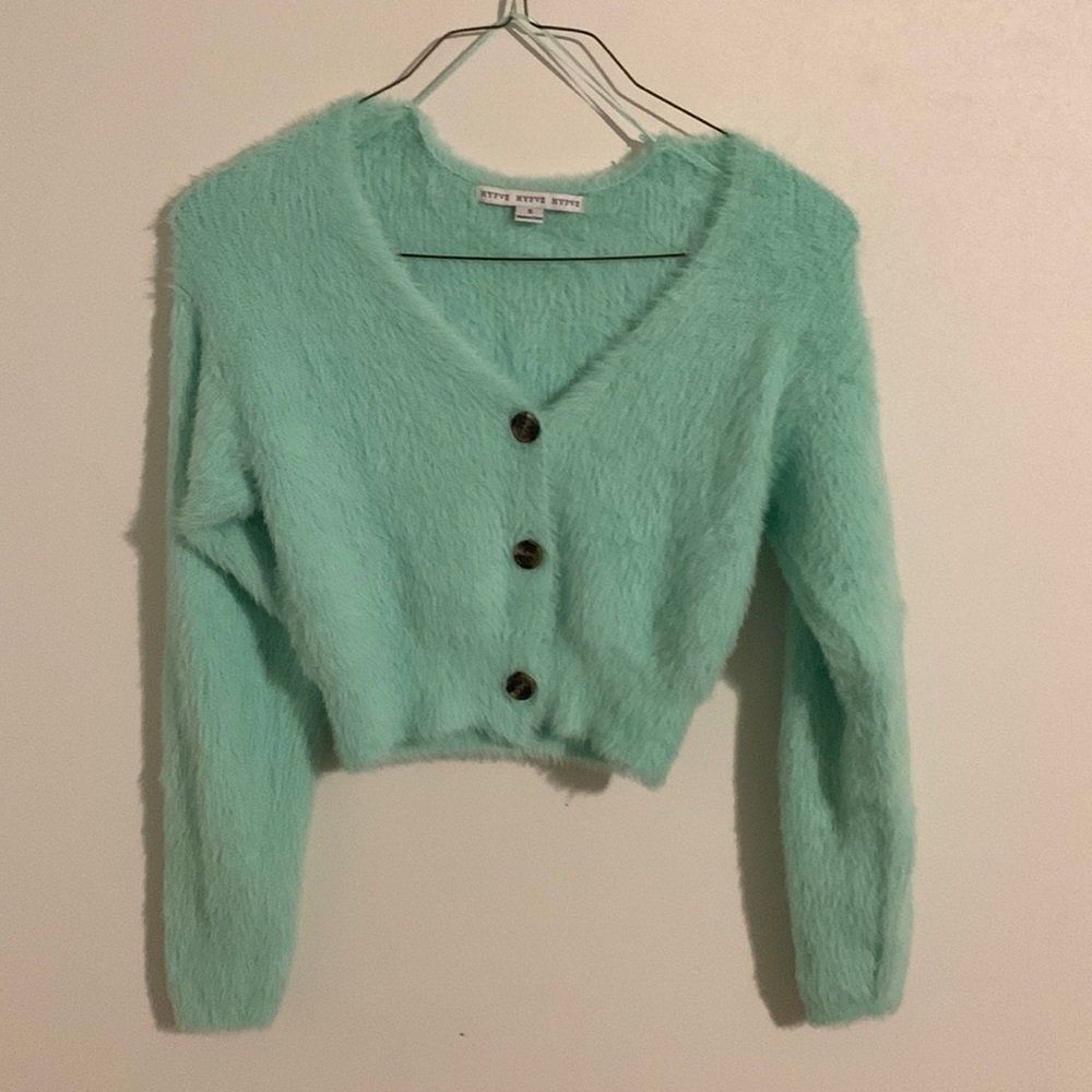 Blue teal color fuzzy shirt.
